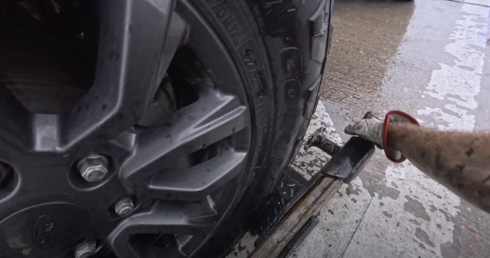 Professional roadside assistance technician helping stranded motorist